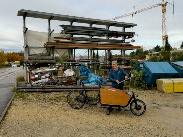 Woodworker sharing his custom build-up for his e cargo bike at his workshop