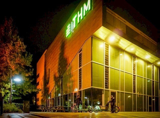 Employees drive on company cargo bikes during work